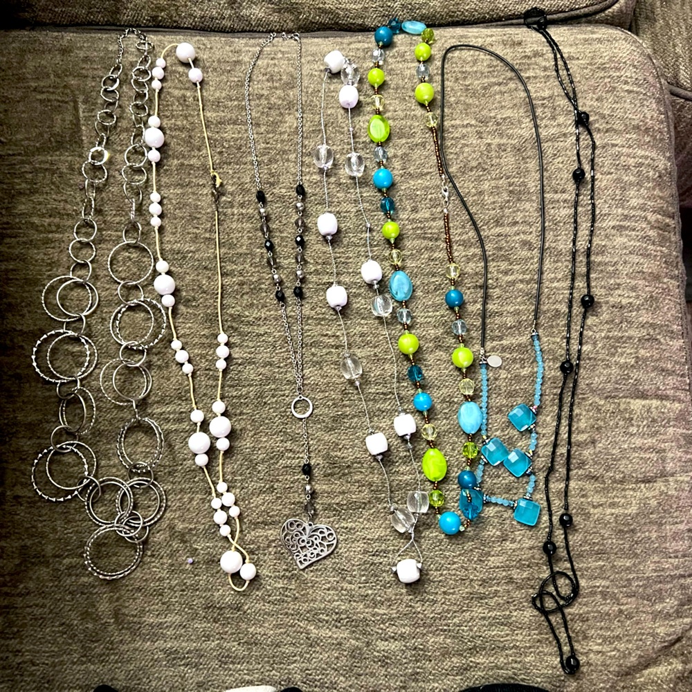 Lot of long necklaces.